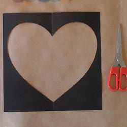 Heart shape cut out from black card stock paper.
