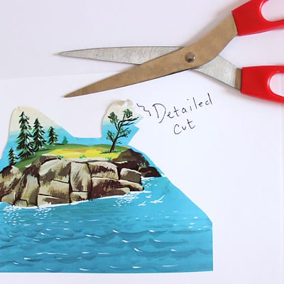 Scissors and an illustration from The Little Island book showing a detailed cut.