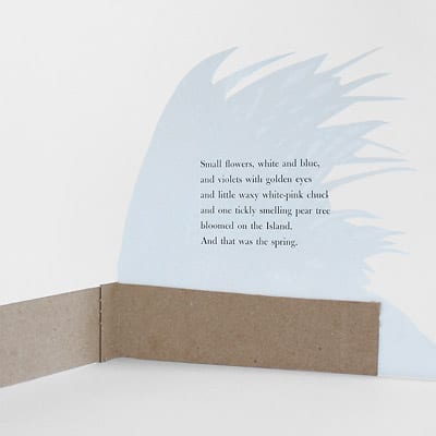 The back side of a foliage illustration cut out and pasted to a folded piece of medium weight craft paper, so that the illustration stands independently.